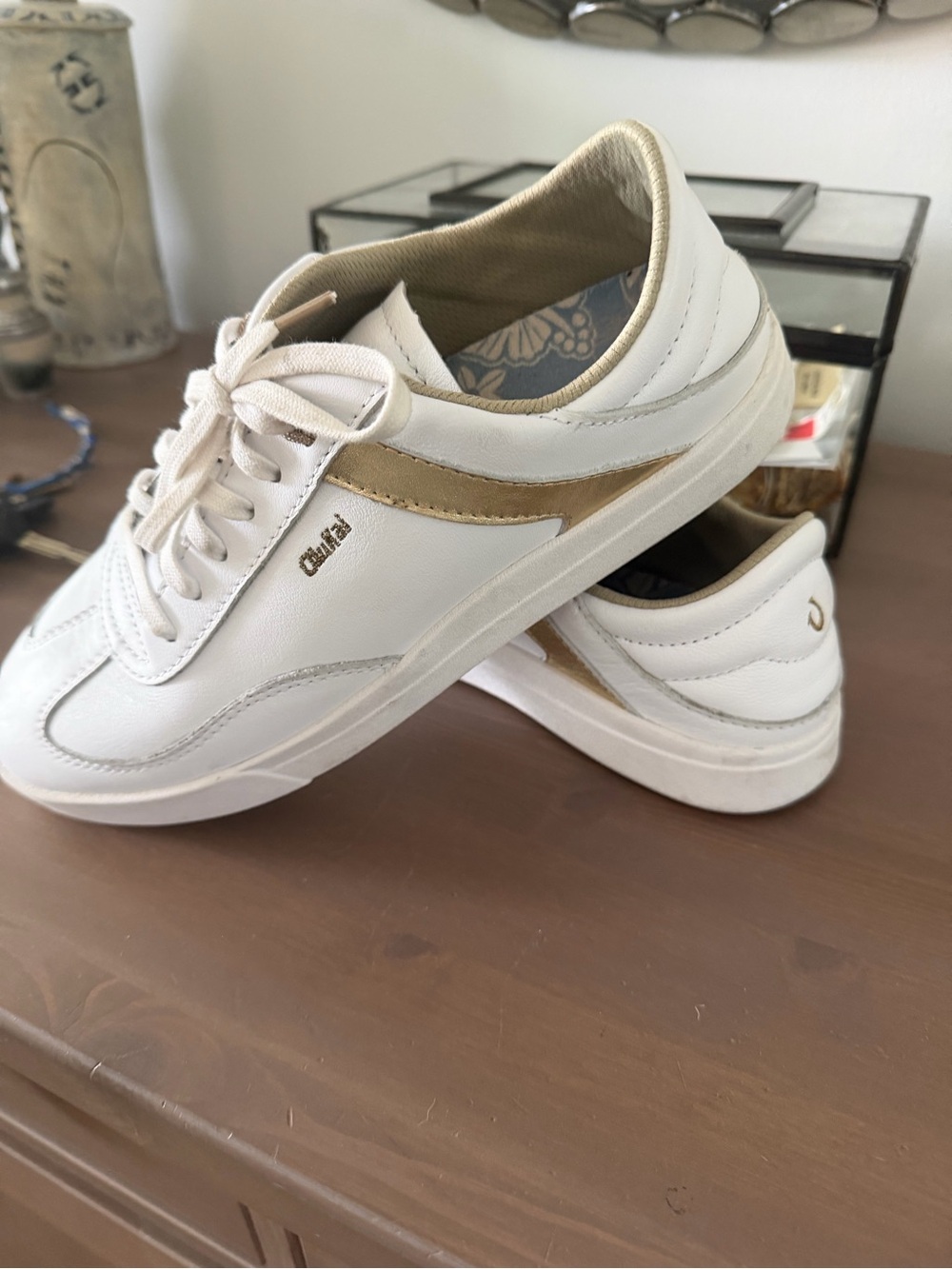 OluKai White Leather Low-Top Sneakers with Gold Accent